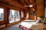 Queen bedroom with large windows and deck for relaxing 